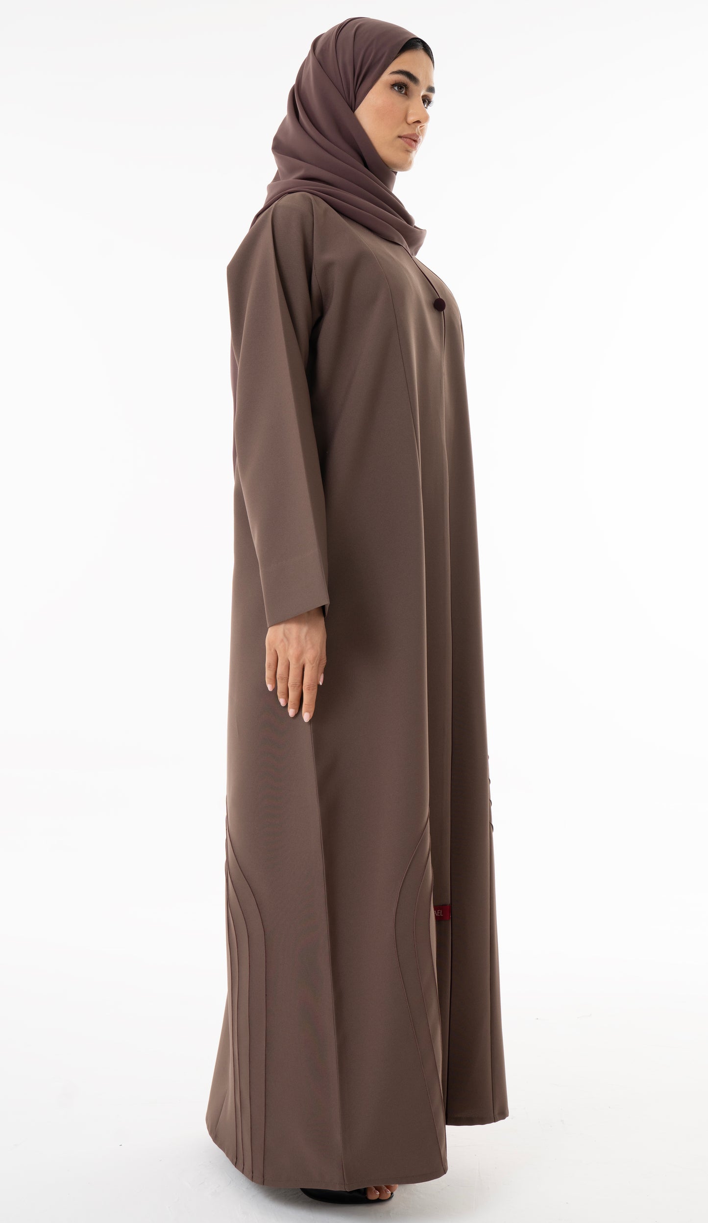 Abaya With Delicate Pin-tucked Detailing In The Front And Back With Contrast Piping In The Front.
