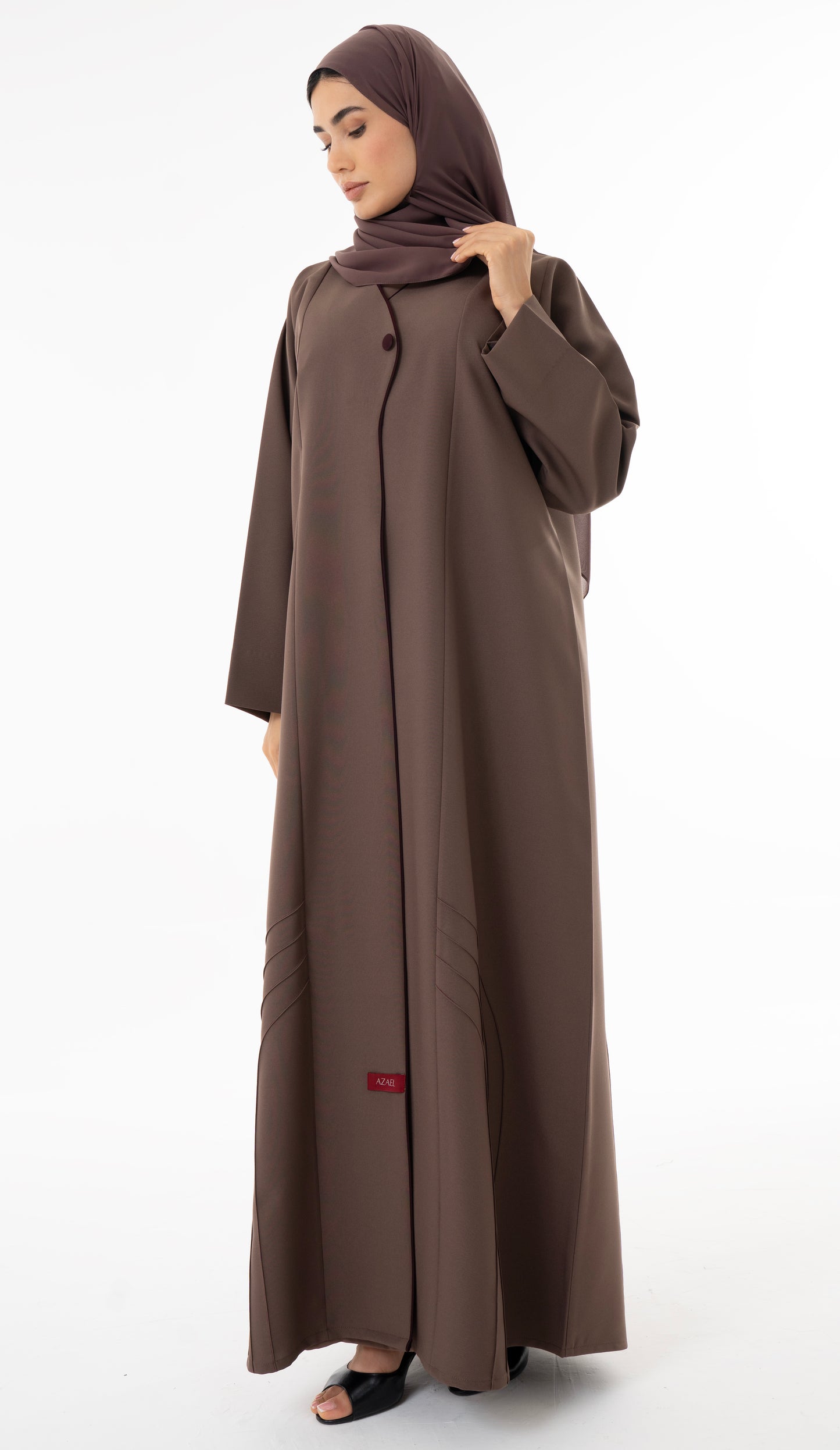 Abaya With Delicate Pin-tucked Detailing In The Front And Back With Contrast Piping In The Front.
