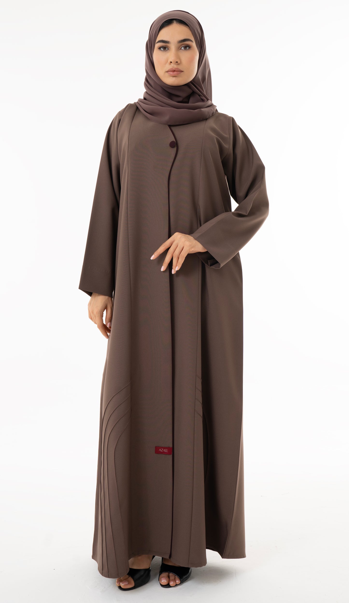 Abaya With Delicate Pin-tucked Detailing In The Front And Back With Contrast Piping In The Front.