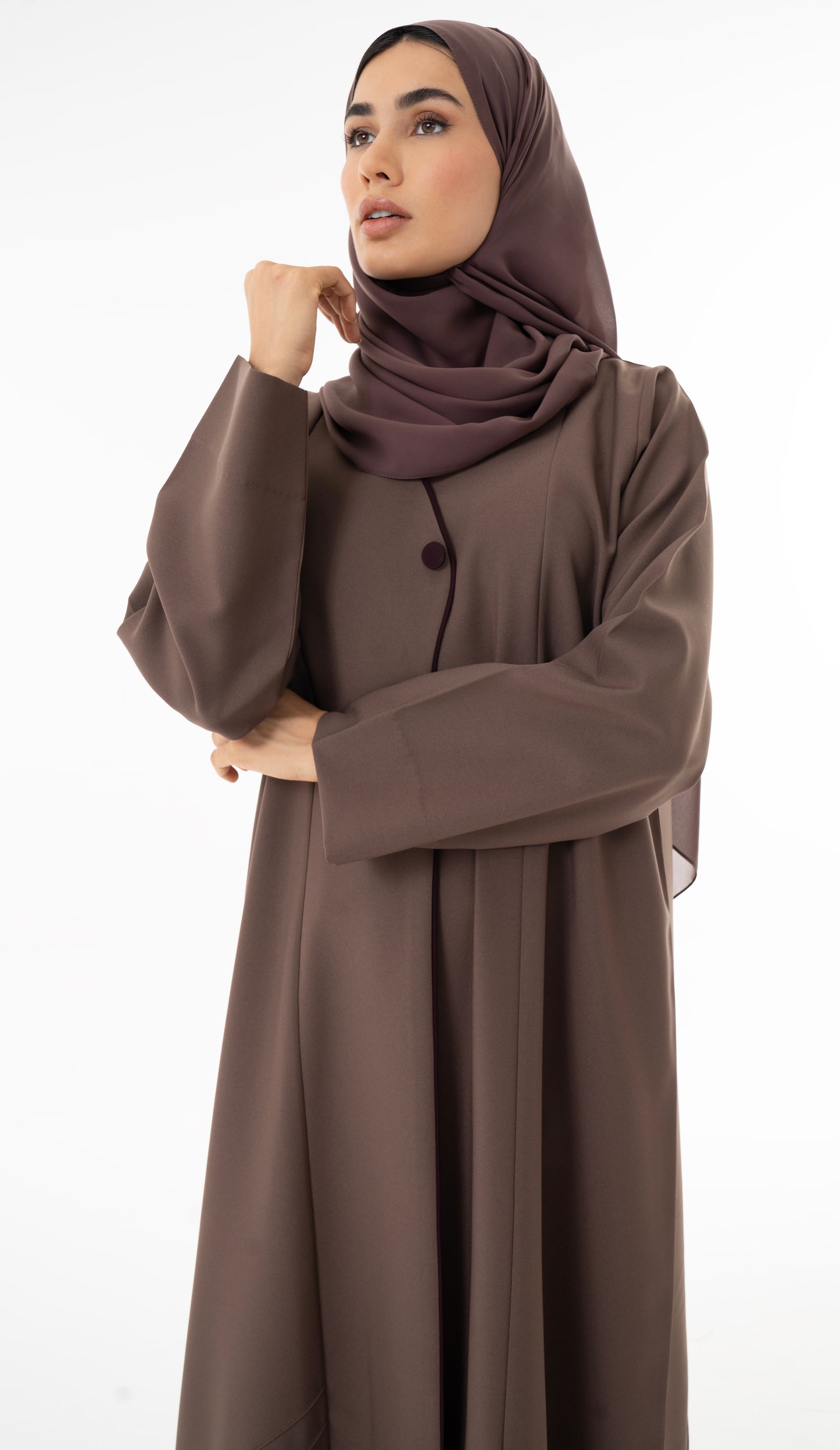 Abaya With Delicate Pin-tucked Detailing In The Front And Back With Contrast Piping In The Front.